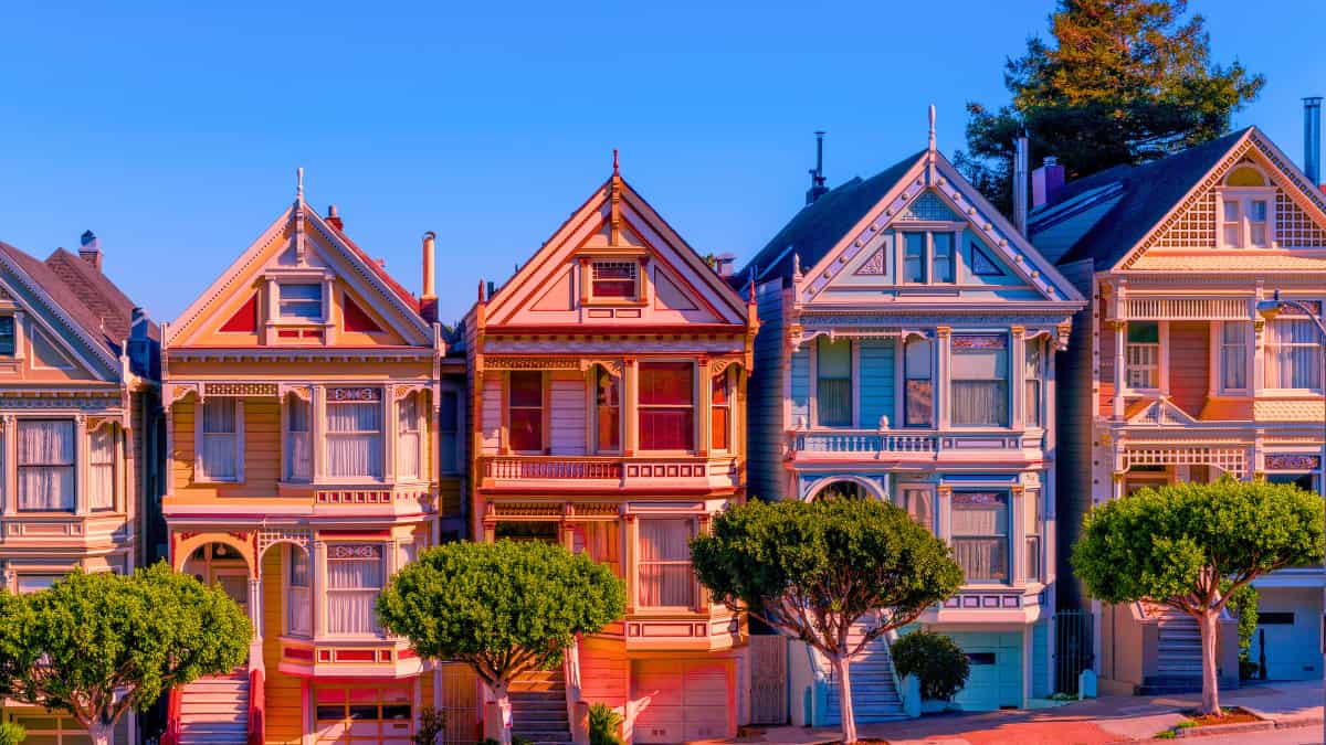 Understanding the Gap: Homeowners Insurance Quotes vs. Your Actual Premium — illustrated by historic Victorian homes that often trigger unexpected premium changes due to age and construction details.