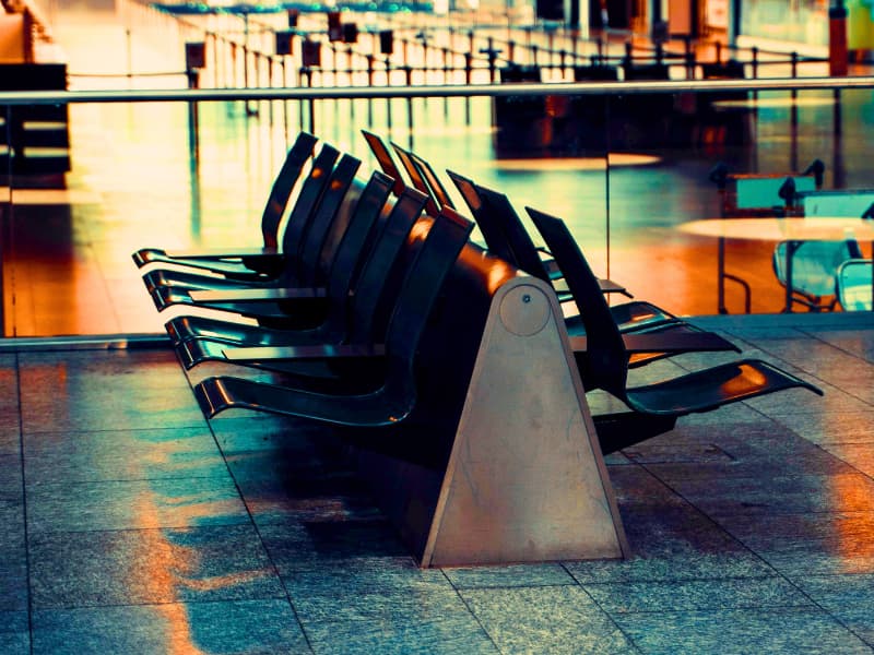 Empty airport waiting area in Europe, representing the critical role of having approved Schengen Visa travel insurance before departure to avoid denied boarding or visa rejections at checkpoints.
