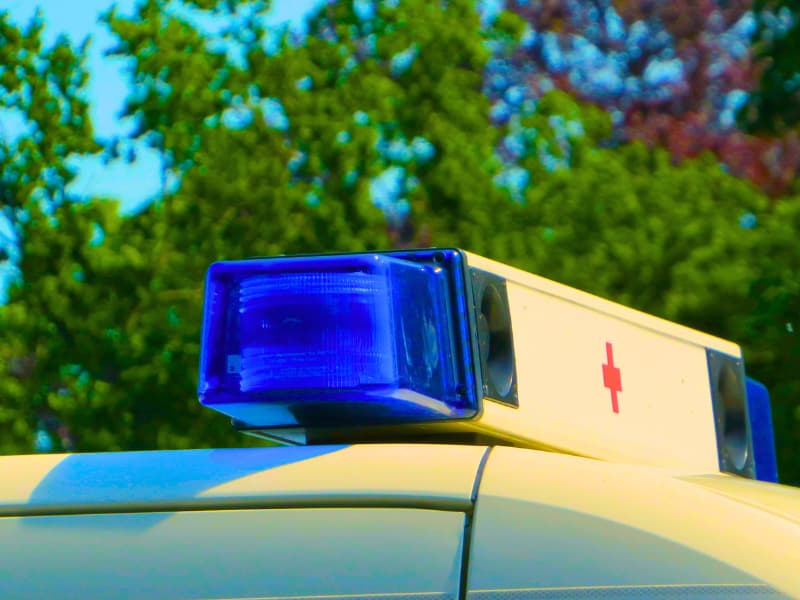 Emergency ambulance siren in a European country, highlighting why Schengen Visa rules require medical repatriation and emergency coverage of at least €30,000 for visa approval.